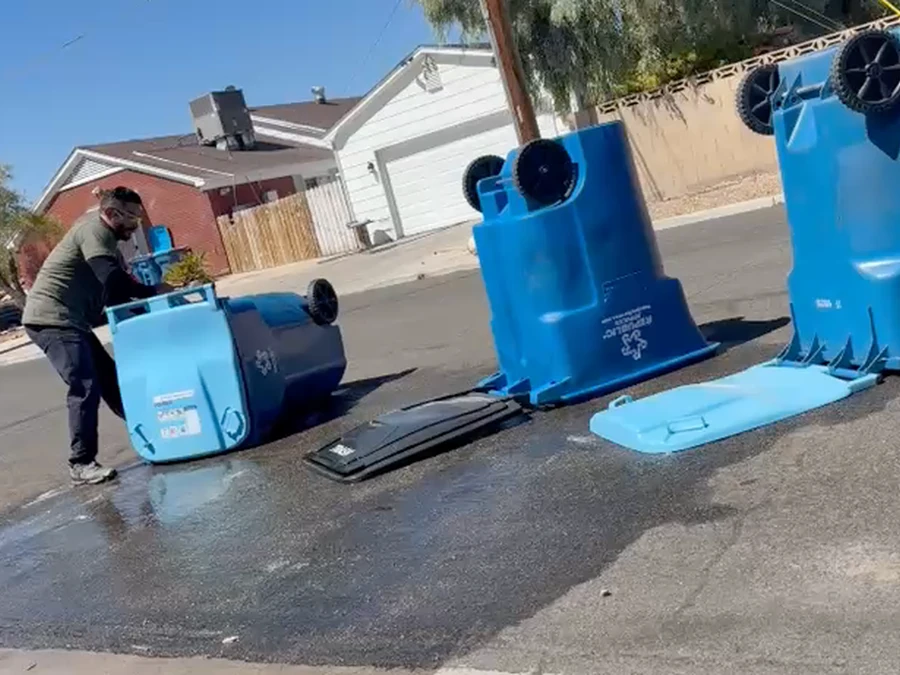 Perez Power Wash cleaning a residential trash bin with high-pressure water in North Las Vegas